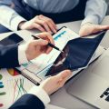 Businessman and businesswoman uses digital tablet